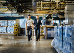 Mechanic and Manager talking and walking in factory